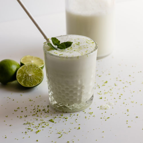 lime and mint milkshake on a while table